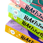 Photo of Heartstopper Volume 1-4 by Alice Oseman on a White Background