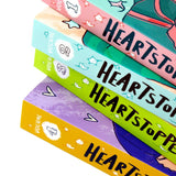 Photo of Heartstopper Volume 1-4 by Alice Oseman on a White Background