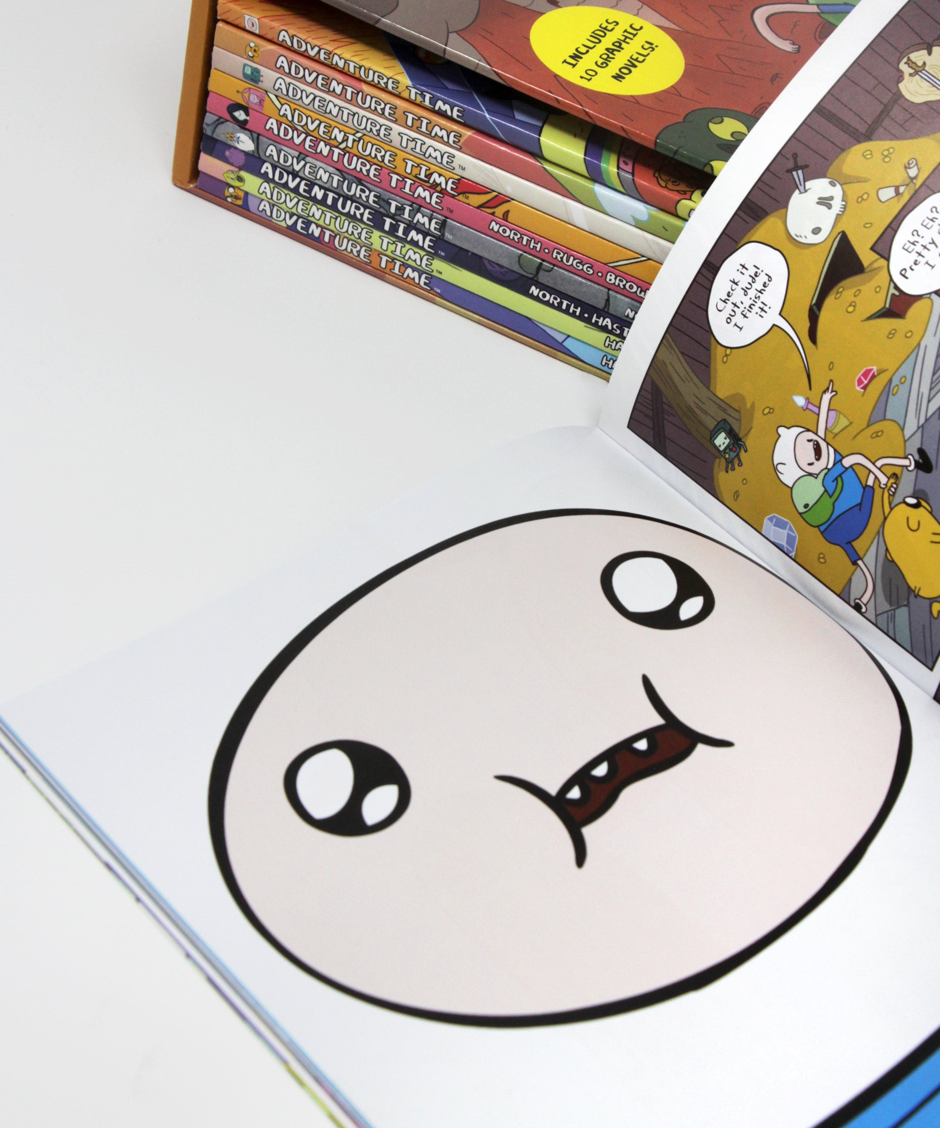 Photo of Adventure Time The Graphic Novel Collection Vol 1-10 Pages on a White Background