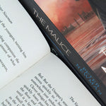 Photo of The Vagrant Trilogy Pages by Peter Newman on a White Background